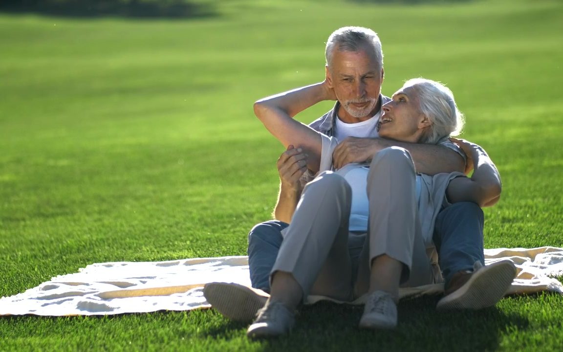 An older couple relaxing outdoors